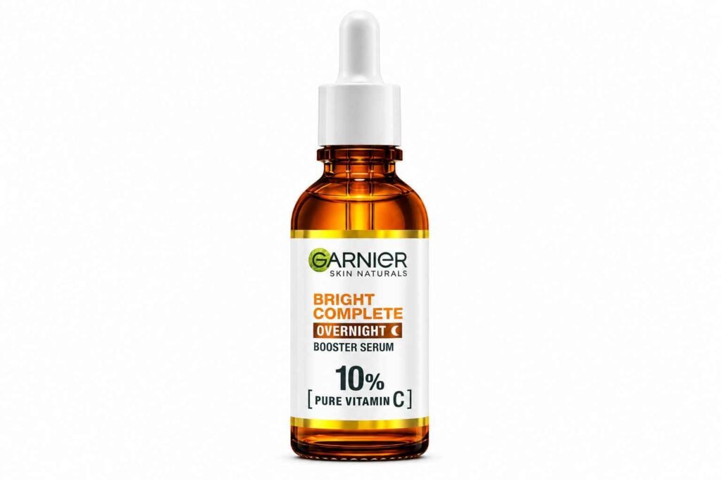 Garnier Bright Complete Overnight Booster Serum with 10% Pure Vitamin C, Hyaluronic Acid, Glycerin, and Vitamin E for brighter, smoother, and hydrated skin overnight.
